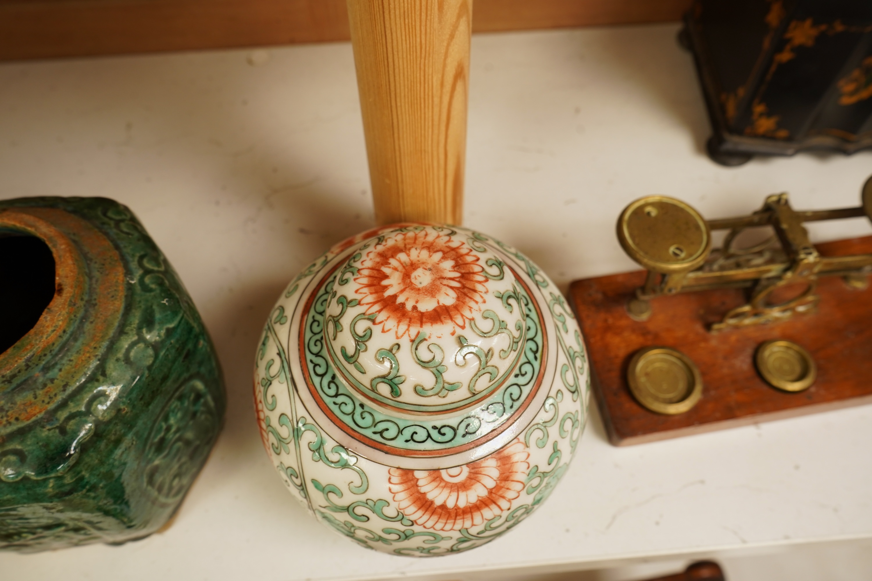 A Chinese famille verte jar and cover and a similar green glazed earthenware jar, tallest 13cm
